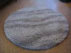 TWO WOOL rugs,  One round rug (5ft diameter) and one....